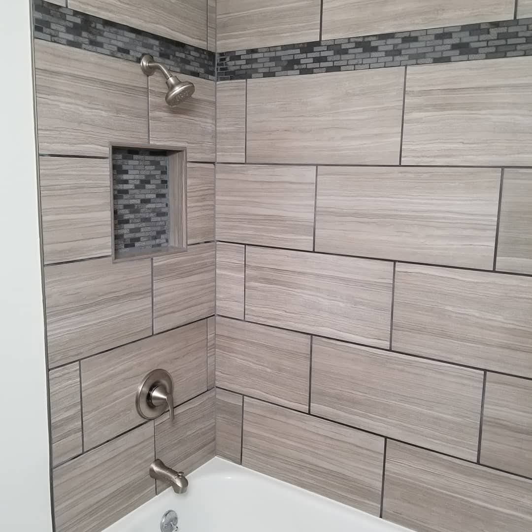 Tile shower niche and shower head detail