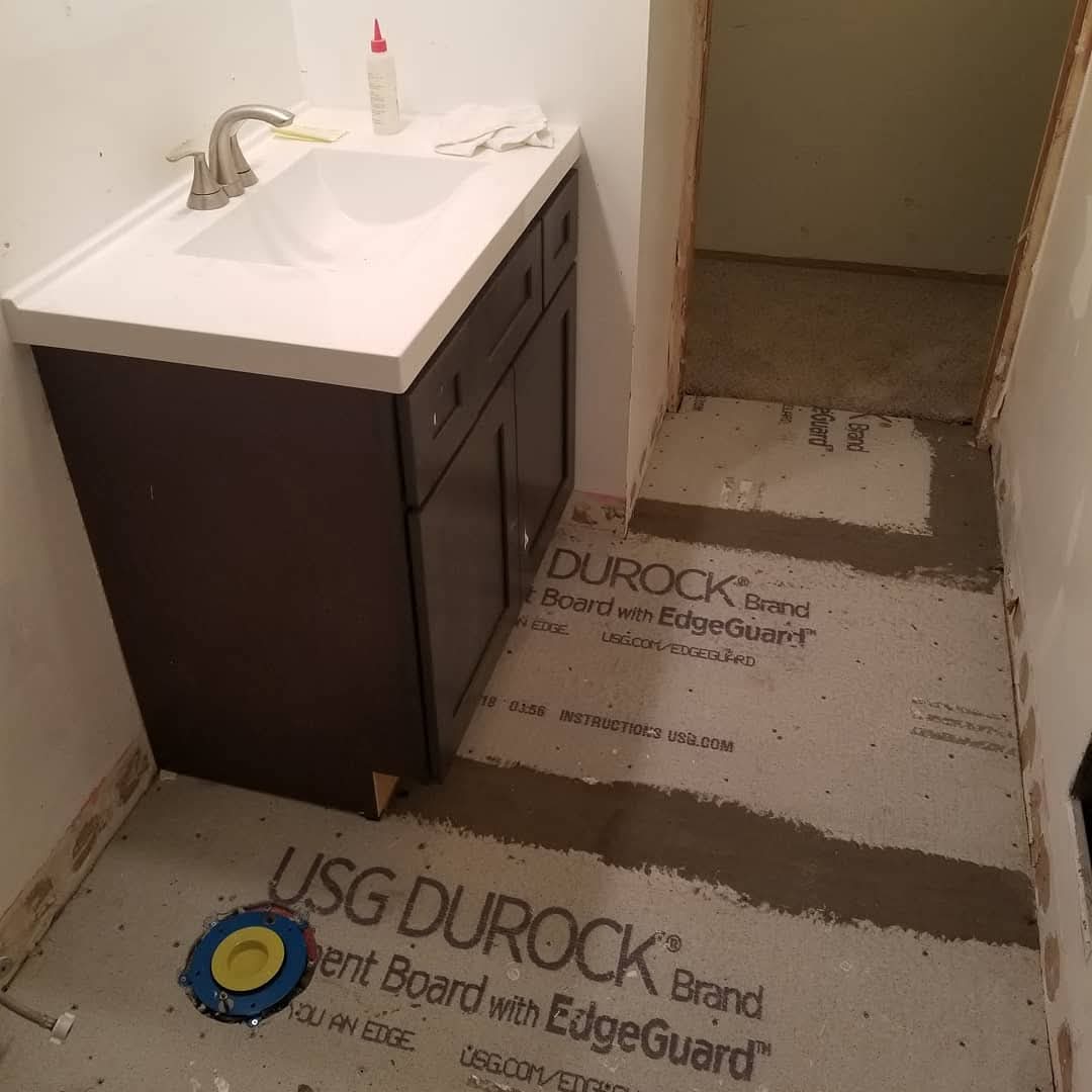New subfloor and vanity installed during bathroom remodel