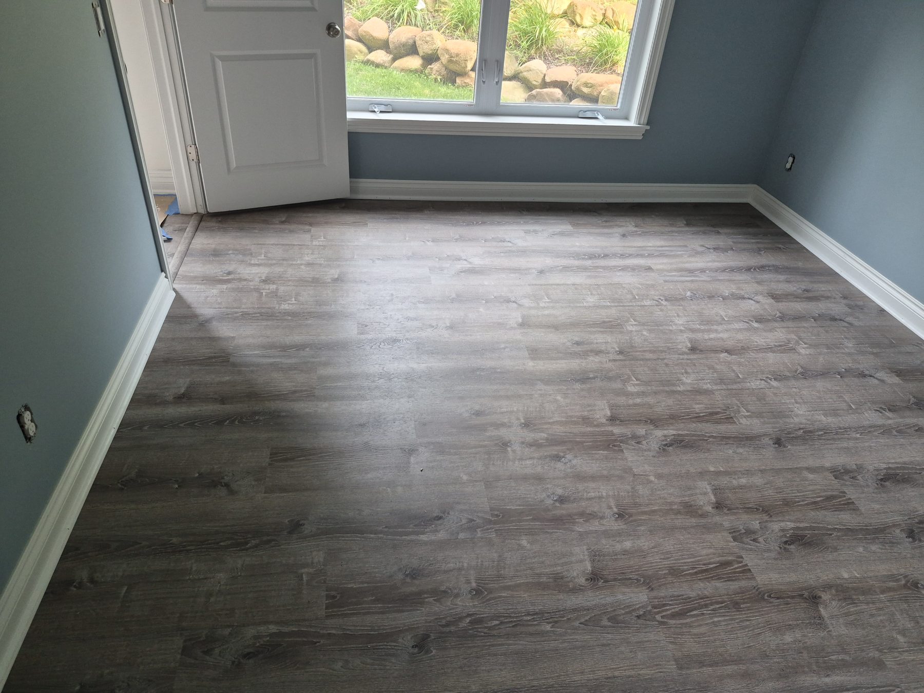 Vinyl plank flooring installed by Ravencraft
