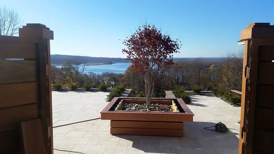 Custom mahogany outdoor carpentry by Ravencraft, patio overlooking lake