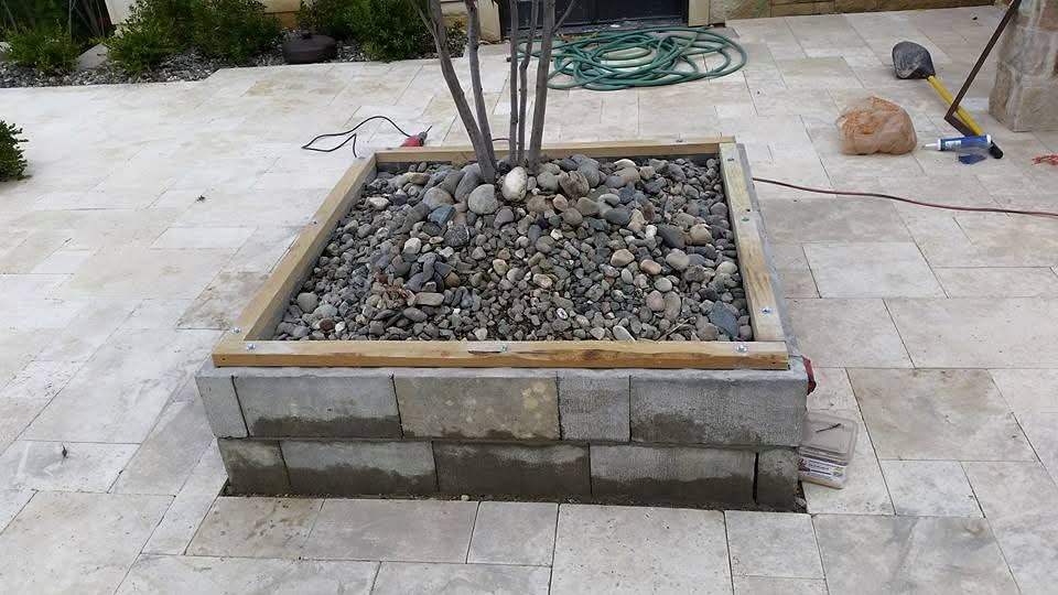 Cinder block base and framing for custom planter