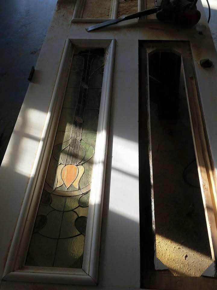 Antique solid wood door reworked to accept custom stained glass panels
