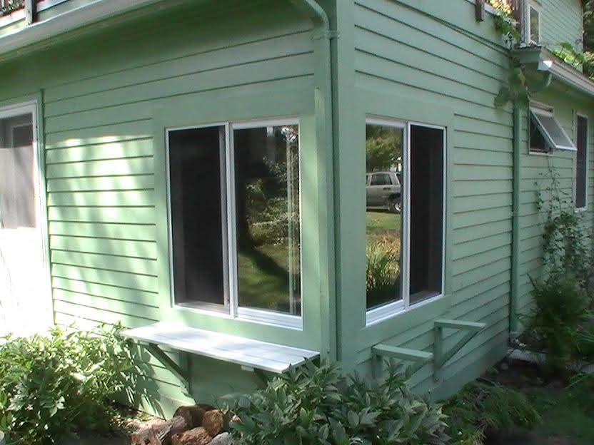 Two new windows with plant shelves installed by Ravencraft